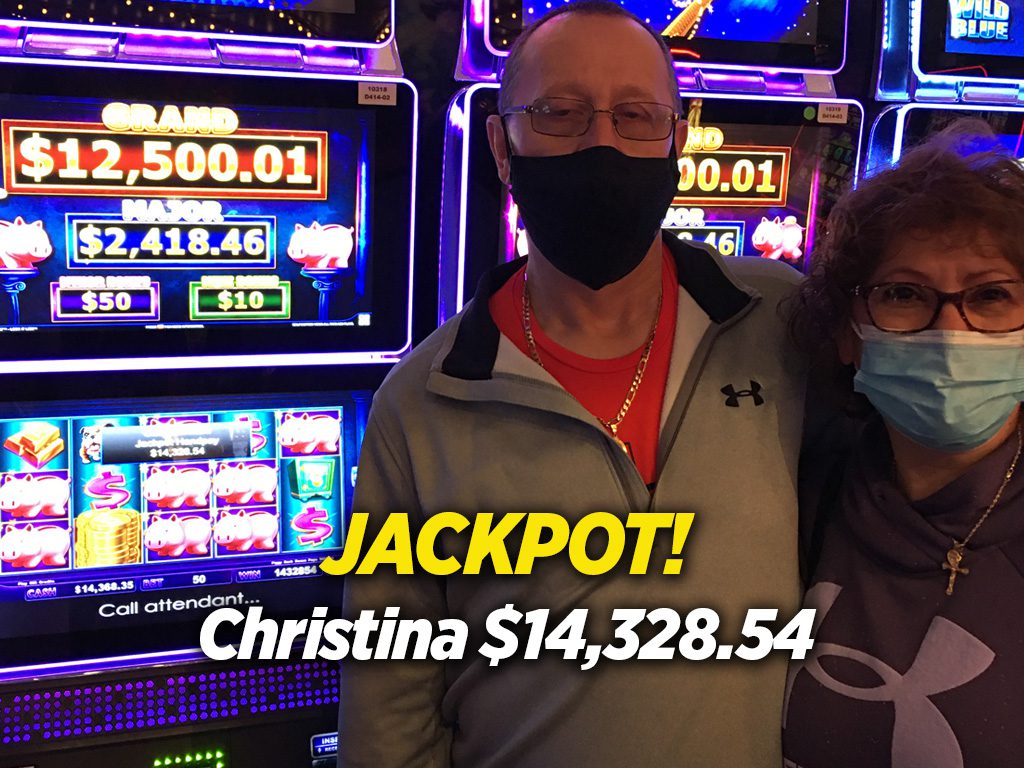 Two people standing in front of a slot machine with the words jackpot christina.