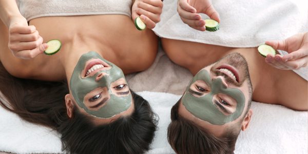 Two people with facial masks on their faces.