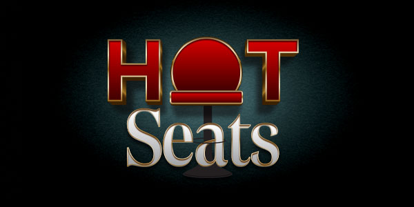 The words "Hot Seats" with the letter "O" in "Hot" replaced by a red circle resembling a seat or stool, set against a dark background.