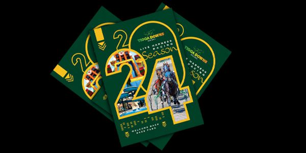 Three green brochures promoting the Tioga Downs 2024 season, featuring images of horse racing and text detailing event information.