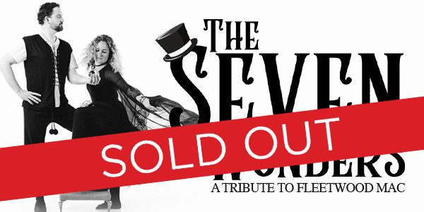 Black and white image of two people with "The Seven Wonders: A Tribute to Fleetwood Mac" text. A red "Sold Out" banner crosses the image.