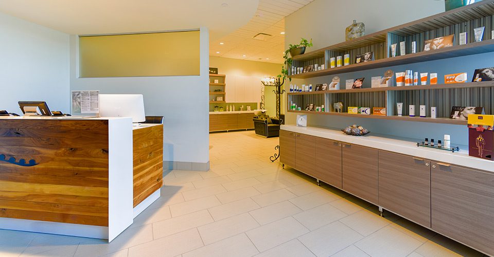 A clean and organized office space with a reception desk.