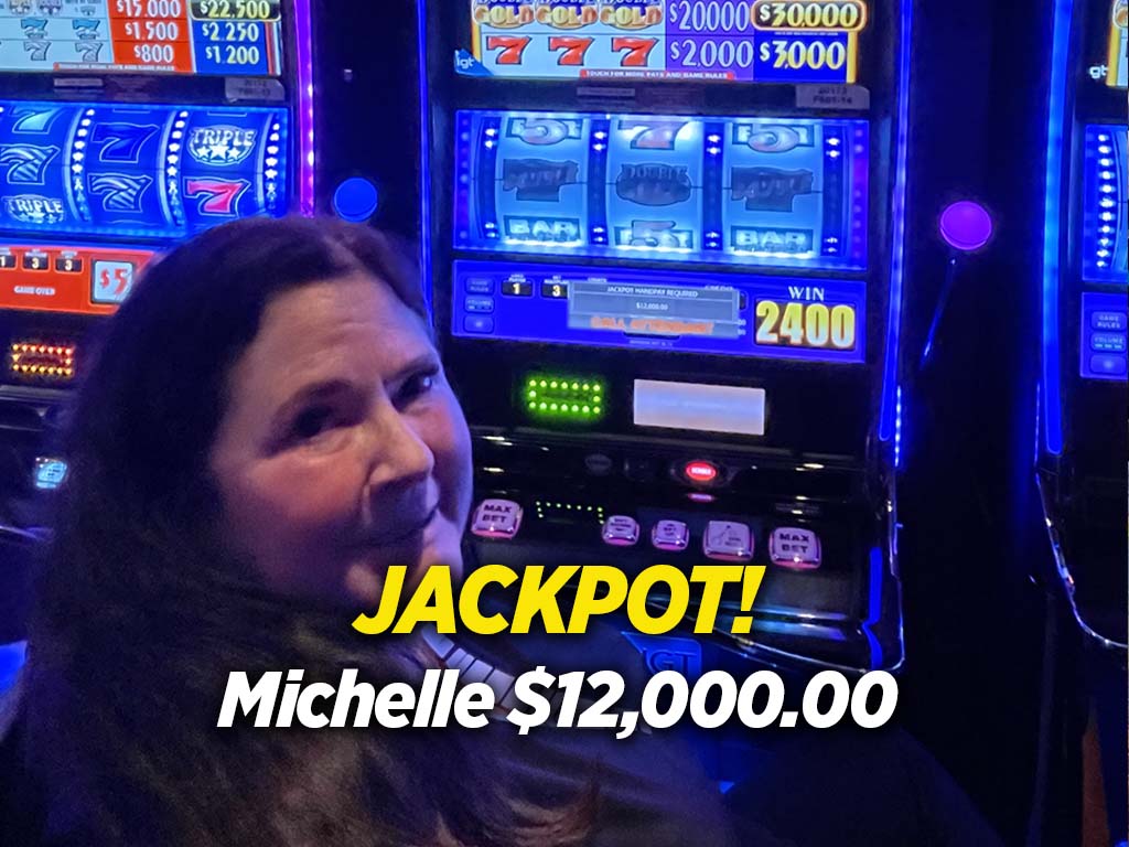 A woman sitting in front of a slot machine with the words jackpot.